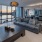 Spacious and well lit kitchen with wood floors and stainless steel appliances in community sky lounge at Lake House