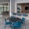 Ample outdoor patio tables and bar near the pool at Lake House